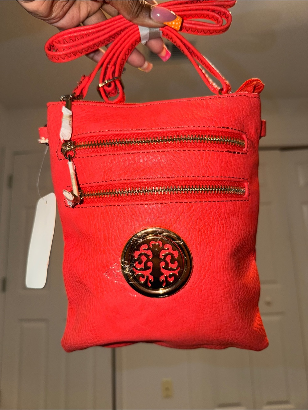 Orange Crossbody Fashion Bag with Gold Medallion